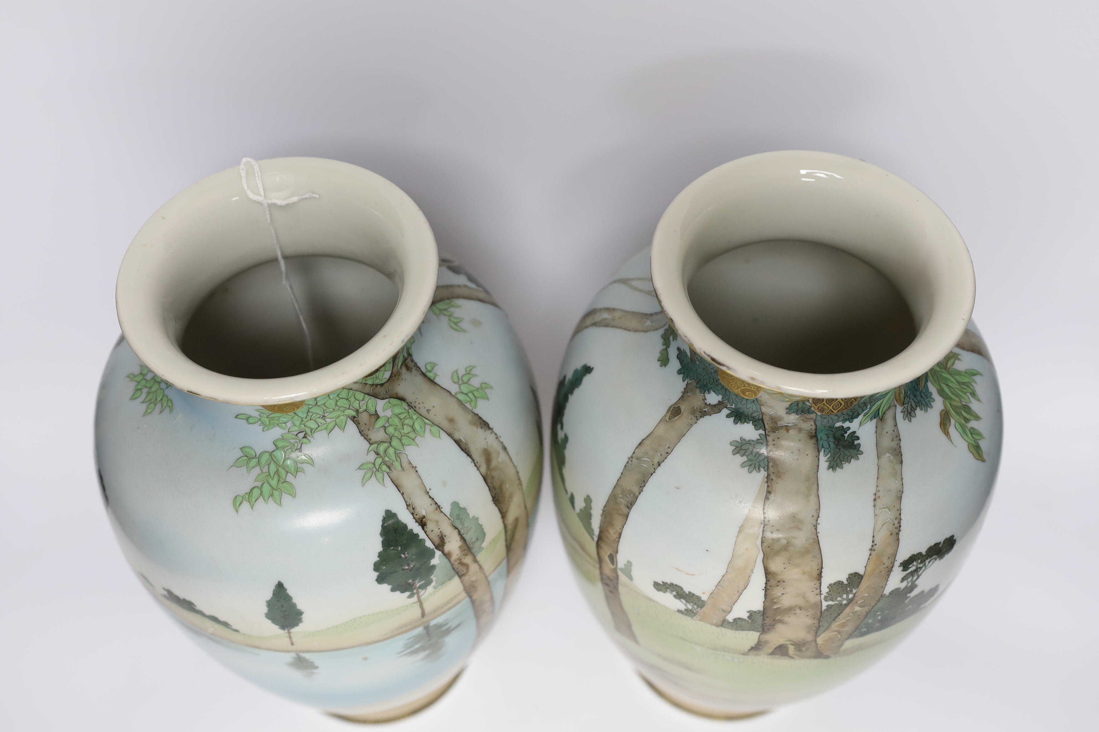 A pair of early 20th century Japanese enamelled porcelain ‘Bijin’ vases, 32cm
